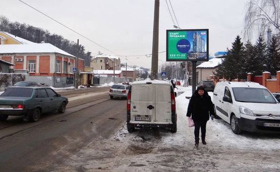 Фото рекламной плоскости по адресу вул.Кирилівська 60/ на Теліги,Петрівка (А) СКРОЛЕР