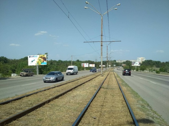 Фото рекламной плоскости по адресу Донецкое шоссе - Кайдакский мост (сьезд с моста), в сторону ул. Передовой