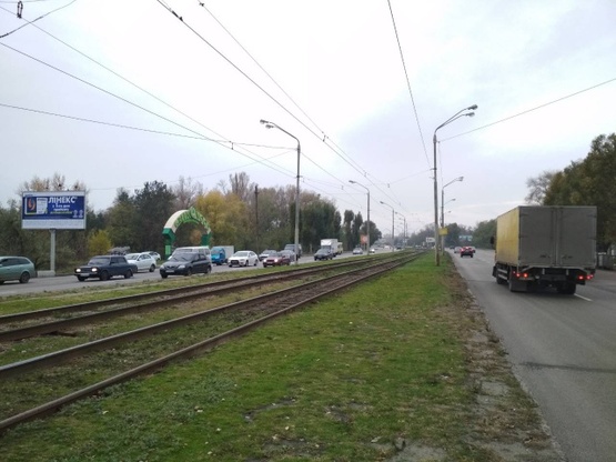 Фото рекламной плоскости по адресу Донецкое шоссе (30 м. от канала, АЗС "ТНК", АЗС "Юкон", ресторан "Робин Гуд"), в направл. Кайдакского моста