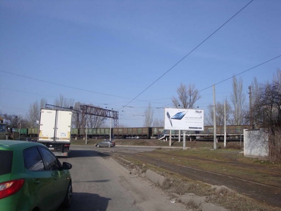 Фото рекламної площини за адресою Каруны ул. - Бажова ул. (АЗС "Rubix", магазин "Рыбалка"), в направл. Амурского моста