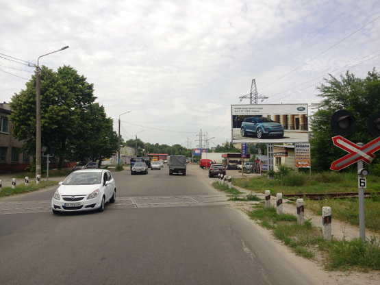 Фото рекламної площини за адресою Шинная ул., 10, (СТО "Тандем", "Таврия", АЗС "Смайл", шиномонтаж), в направл. ул. Героев Сталинграда