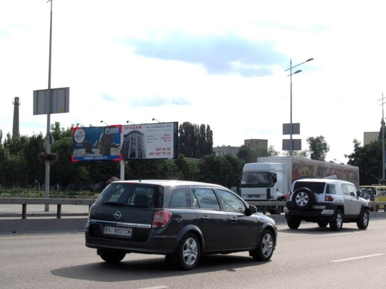 Фото рекламной плоскости по адресу Бажана Н. просп. - Харьковская пл., (АЗС "УкрАВТО", Авто сервис АТЛ), въезд в Киев, (левый)