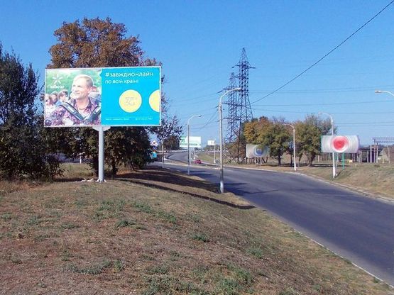 Фото рекламной плоскости по адресу Дорожная ул., от Днепропетровской ул., в центр (СТО "BMW")