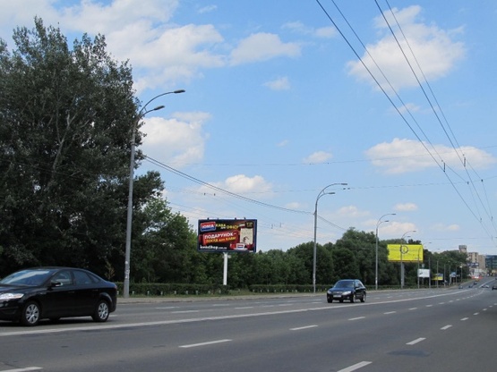 Фото рекламной плоскости по адресу Лобановского Валерия просп. (Краснозвездный просп.) (300м до ул. Кировоградская), АЗС "WOG", Совские пруды, ресторан "Нарния", направ. Московской пл.
