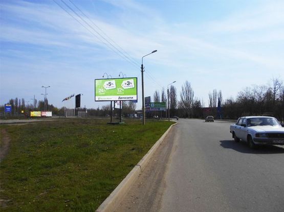 Фото рекламной плоскости по адресу Быкова ул.,  въезд  в "МЕТРО"