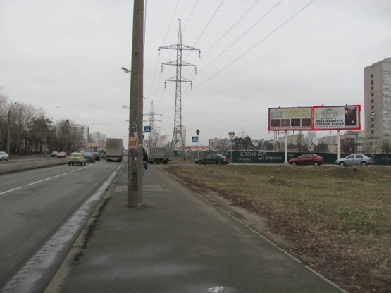 Фото рекламной плоскости по адресу Хоткевича Гната ул. (Красногвардейская ул.), 2, (заправка ТНК, Супермаркет «NOVUS», KFC, переезд с просп. Ю.Гагарина на ул. Красногвардейскую)