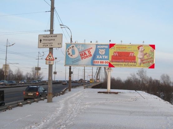 Фото рекламной плоскости по адресу Московский мост - Бандеры С. просп. (просп. Московский) (перед Московским мостом, в сторону Троещины), призма