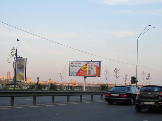 Фото рекламной плоскости по адресу Набережное шоссе, эл. опора 27 (600м. от ст. м. Днапр, в напавлении Надднепрянского шоссе)