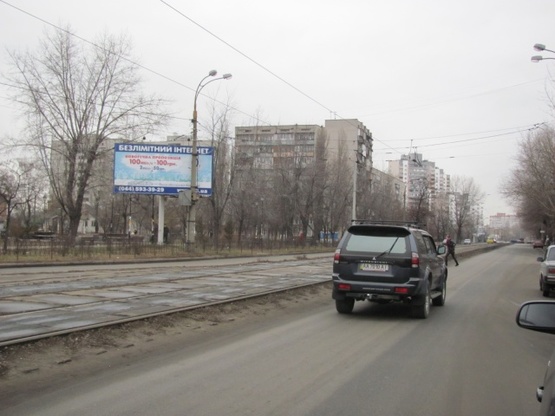 Фото рекламной плоскости по адресу Алма-Атинская ул., напротив №4 (маркет "Фора", салон красоты "Ника"), направ. из центра города
