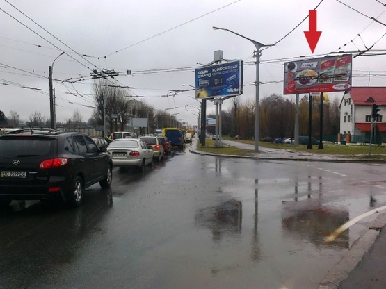 Фото рекламной плоскости по адресу Стрийская ул. -  Рубчака ул. (парк Борнаровка, магазин "Контемпо", УкрєксимБанк, аптека "Галецкий провизор"), направление к магазину " Praktiker")
