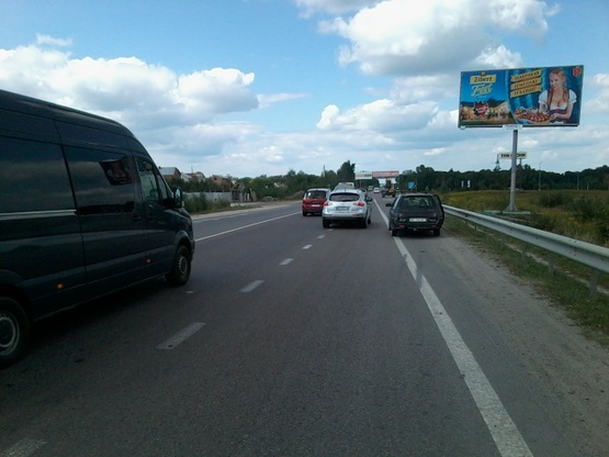 Фото рекламной плоскости по адресу Городоцкая ул., 302, ("Эпицентр", "МЕТРО", АЗС "Атмосфера Центр", ресторан "Пицца на дровах", мебельный салон "Три слона", въезд к автосалонам "Хонда", "Тойота"), в направл. ул. Шевченко