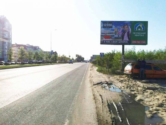 Фото рекламной плоскости по адресу Святопетровское, ул.Белогородская, напротив ЖК "Петровский Квартал"