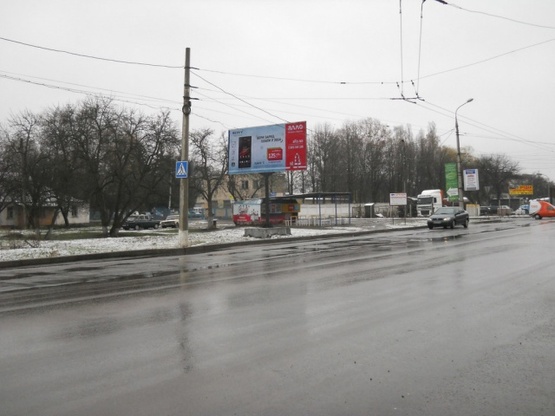 Фото рекламної площини за адресою Белопольское шоссе, 38, (рядом салон "Toyota", "In-Time", АЗС "ANP"), направл. в центр города