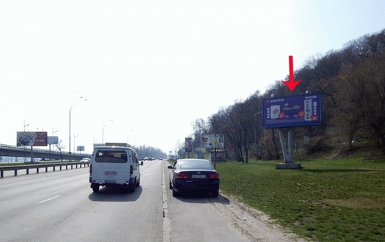 Фото рекламної площини за адресою Набережное шоссе перед выездом с Днепровского спуска по направлению к мосту Патона (нижний)