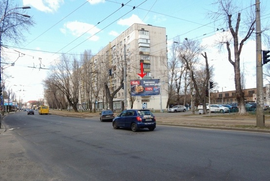 Фото рекламной плоскости по адресу Фрунзе ул. 152, от Куренёвского парка, из центра