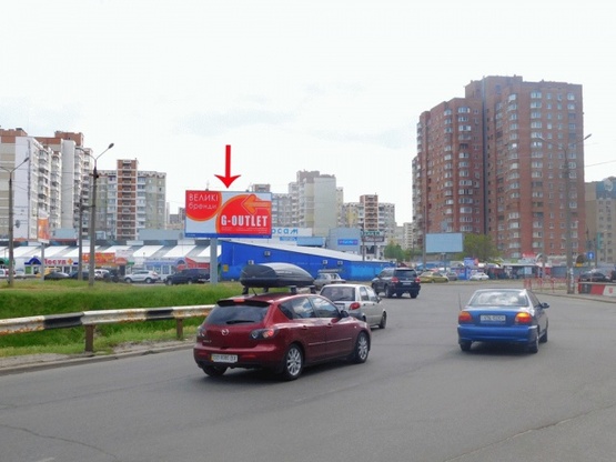 Фото рекламной плоскости по адресу Ревуцкого ул., возле ул.Ахматовой, на клумбе, в сторону пр-та Бажана