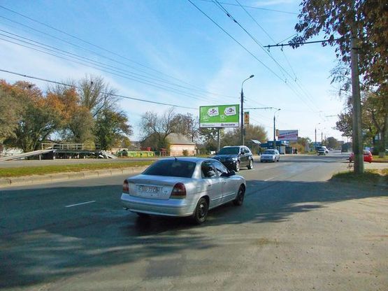 Фото рекламної площини за адресою Белопольский путь ул., 18 (ГАИ) (магазин "Автозапчасти", АЗС "Маршал", АЗС "Авіас") в центр