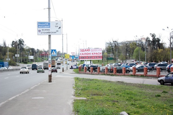 Фото рекламної площини за адресою Палладина, крупная транспортная развязка, на территории автостоянки, перед въездом на мост пр-т., Победы