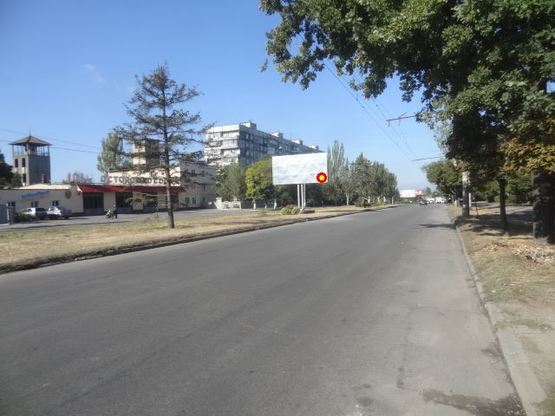 Фото рекламной плоскости по адресу вул.Комарова - вул.Парамонова, напрямок руху від вул.Комарова пожарка слева (в город)