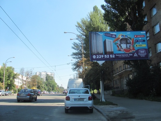 Фото рекламной плоскости по адресу Соломенская ул., 20 (Библиотека им.. В.Кудряшова, маркет "АТБ", "Конверс Банк"в направ. Протасового яра)