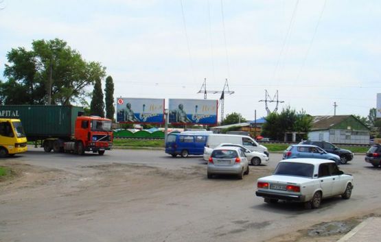 Фото рекламной плоскости по адресу Дальницкое шоссе / ул. Крайняя (Рынок) №2 "Чебурашка"