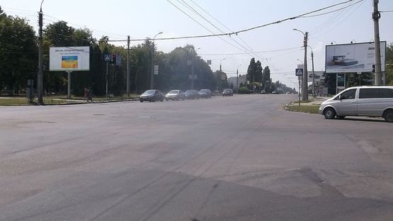 Фото рекламной плоскости по адресу Сумгаитская ул., - Королёва ул., (АЗС OKKO , Автосалон UA Holding, завод "Богдан")