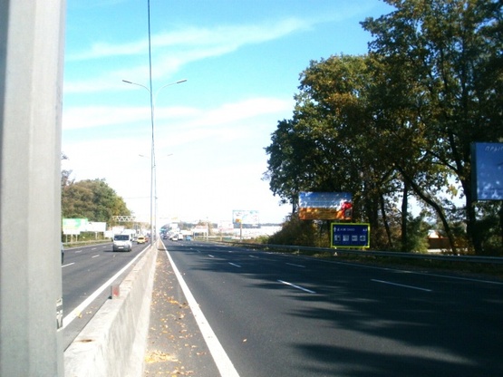 Фото рекламной плоскости по адресу Одесская трасса, 300 м до Новой Линии, направление в Киев