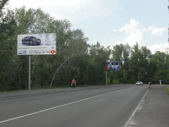 Фото рекламной плоскости по адресу Слобожанский пр., въезд с Малиновского ул., возле супермаркета "Fozzy", в центр