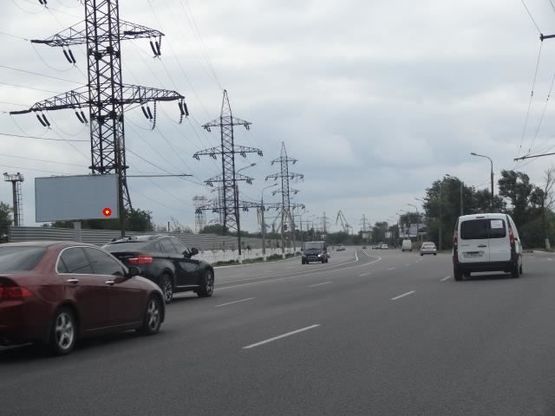 Фото рекламной плоскости по адресу Заводская Набережная ул., напротив АЗС "Glorius", из центра