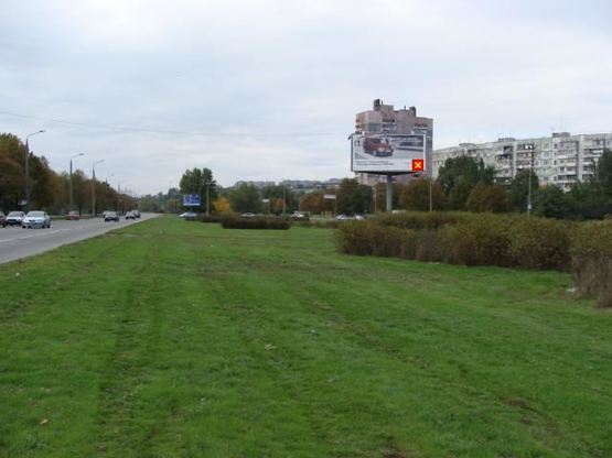 Фото рекламной плоскости по адресу Набережна магістраль - вул.Українська (коло), напрямок руху до порту