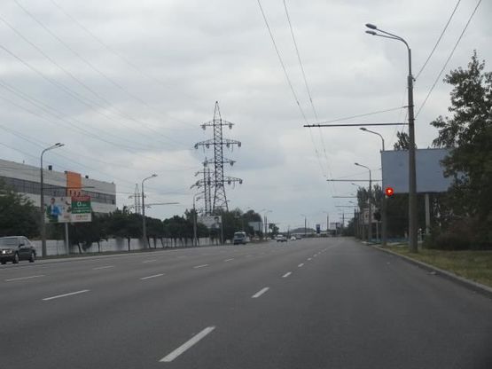 Фото рекламной плоскости по адресу Заводская Набережная ул., возле кафе "СМАК", из центра