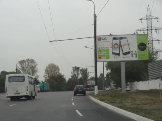 Фото рекламной плоскости по адресу Заводская Набережная ул., напротив АЗС "Glorius", в центр