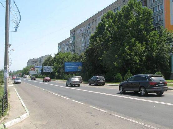 Фото рекламной плоскости по адресу ул. 1 Мая, 17, Основной транспортный поток, городская Стоматология, Гинекология, детский юнешеский клуб "Дюк", высотный микрорайон "Стройтехснаб"