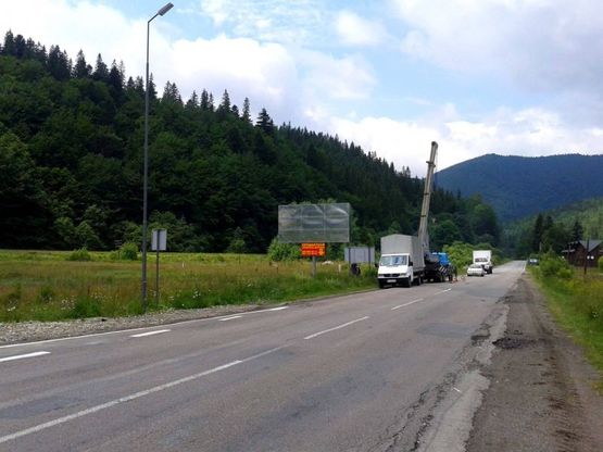 Фото рекламної площини за адресою Траса Н-09 Мукачево-Львів, виїзд з села, 100 м після АЗС ОККО, напрямок руху на Івано-Франківськ