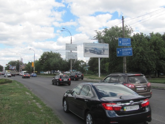 Фото рекламной плоскости по адресу Ивашкевича ул./ ул. Автозаводская (АЗС "ANP",Мото-планета,  автосалон "Hyundai", в направ. к ТРЦ "Караван")
