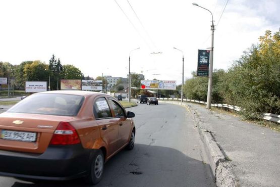 Фото рекламної площини за адресою розв'язка вул.Кам'янецька - вул.Толстого - Львівське шосе. (від центру, на ринки)