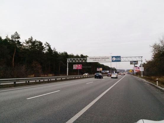 Фото рекламной плоскости по адресу Житомирская трасса  22,300 км  - Стоянка - в направлении Киева