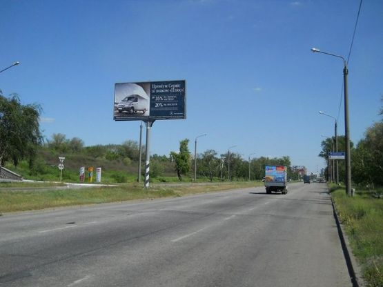 Фото рекламної площини за адресою Набережна магістраль - Вознесенівський ринок (автомойка «Кристалл»), напрямок руху до вокзалу