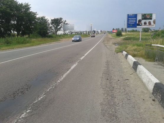 Фото рекламної площини за адресою М-10, Західний обхід м.Львова, км 0+400, Фуджікура Аутомотів, Сканія Львів, ліворуч