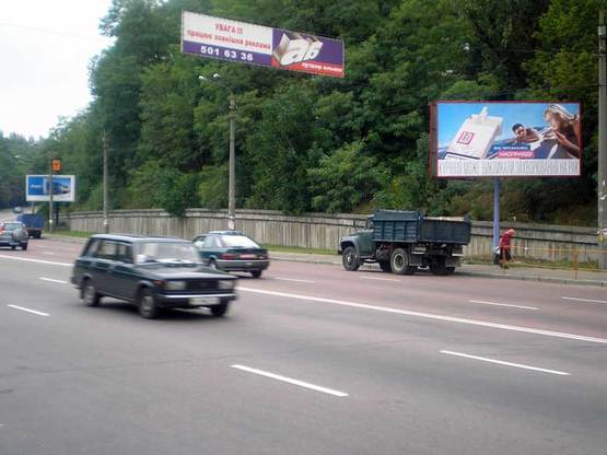 Фото рекламной плоскости по адресу ул.Телиги, ул.Захаровская направление на Дорогожичи