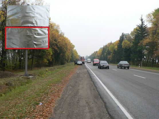 Фото рекламної площини за адресою Траса Н-09 Мукачево-Львів, смт.Богородчани виїзд з смт. в сторону Івано-Франківська, супермаркет Світ Богородчан, після АЗС WOG, напрямок руху на Івано-Франківськ