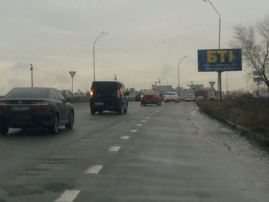 Фото рекламной плоскости по адресу Выезд с Новообуховской трассы на Ак.Заболотного