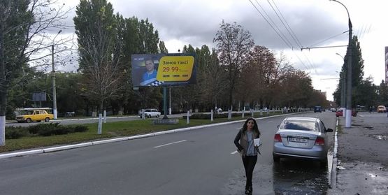 Фото рекламной плоскости по адресу ул. Киевская, район д. 63 и ост. Автопарк (в центр)