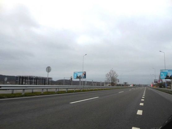 Фото рекламної площини за адресою Новообухівська траса, возле ресторана "Танжер", км 25+700 праворуч