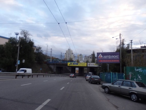 Фото рекламной плоскости по адресу Льва Толстого ул. за выездом с ул.Вокзальная (напротив дома 63, перед ж/д мостом)