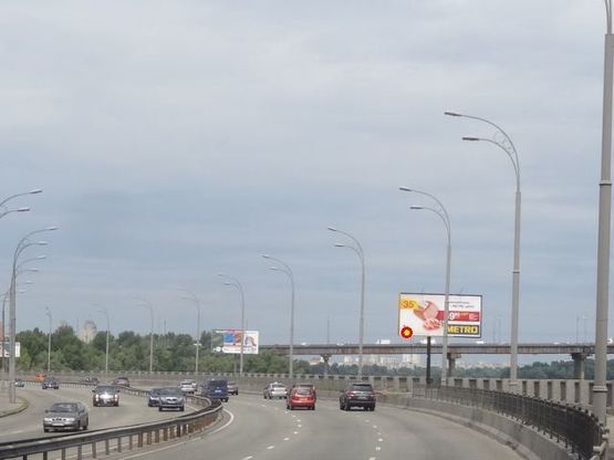 Фото рекламной плоскости по адресу Набережнo-Рыбальская ул. , 75 м от ж/д моста к пр. Московский