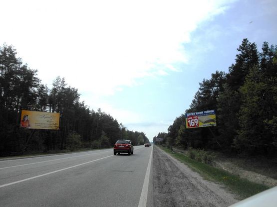 Фото рекламной плоскости по адресу Конча-Заспа, траса Р-02, км 34+900 право, поворот на с. Плюти