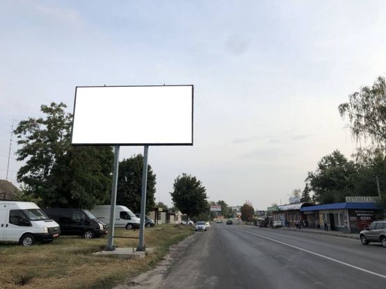 Фото рекламной плоскости по адресу Находится на автодороге Харьков - Симферополь (М18) (слева от дороги), по ул. Днепропетровская, на противоположной стороне от Мерефянской ЦРБ (автобусная остановка «Больница»).