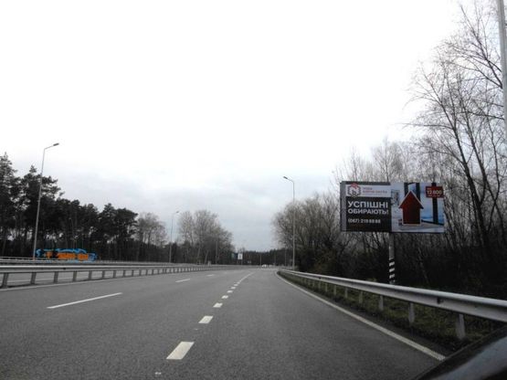Фото рекламной плоскости по адресу Новообухівська траса, перед рестораном "Матрешка", км 28+050 лево