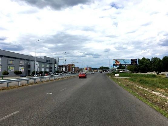 Фото рекламної площини за адресою Дніпровське шосе, поворот на с. Ходосеевка, напротив ТРЦ "Мегамаркет в Ходосіївці", "Киев-Обухов", км 23+850 лево